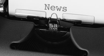 old typewriter, paper with text NEWS